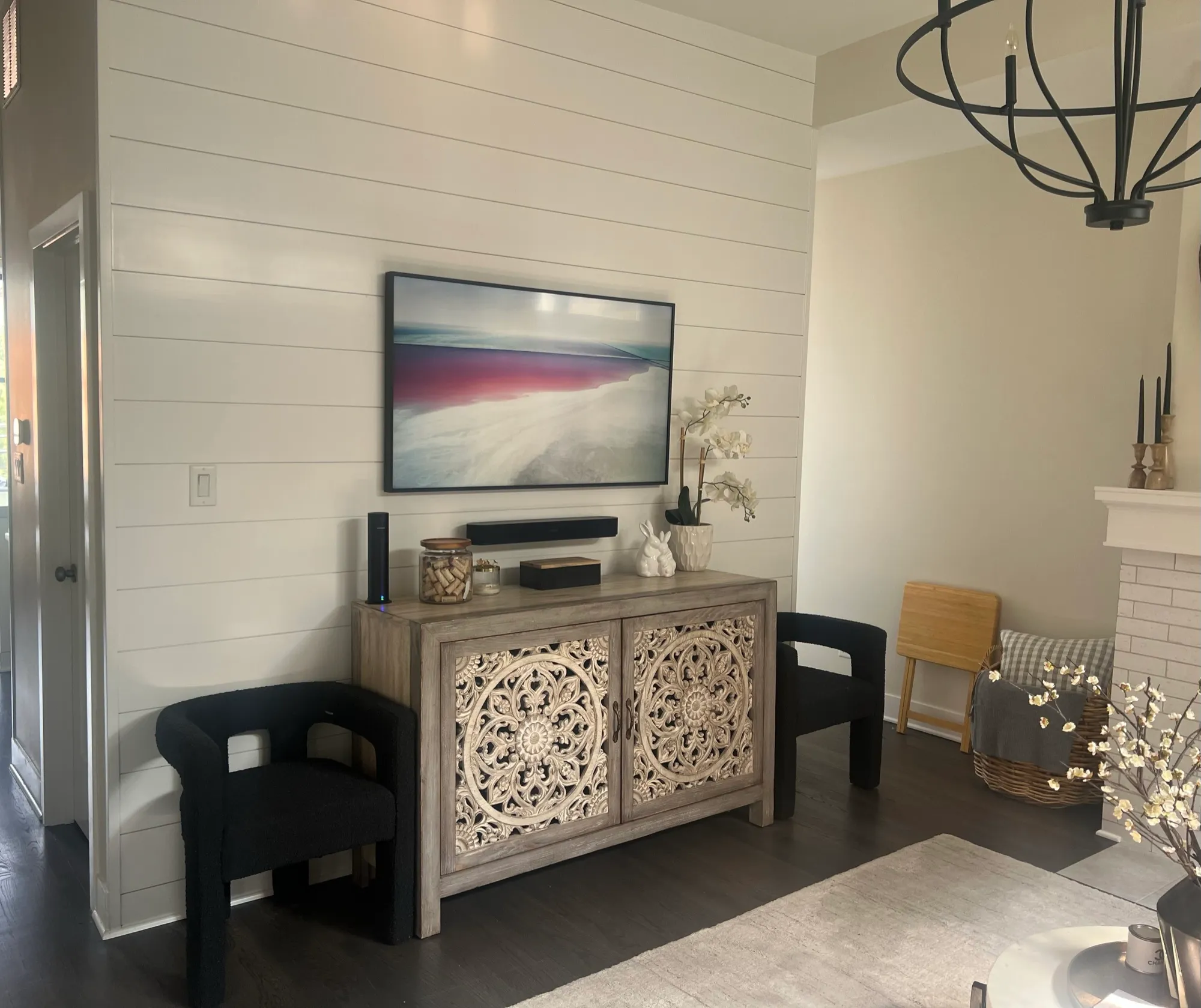 A Frame television displaying artwork on a shiplap wall, installed by Excel Technology Integration.